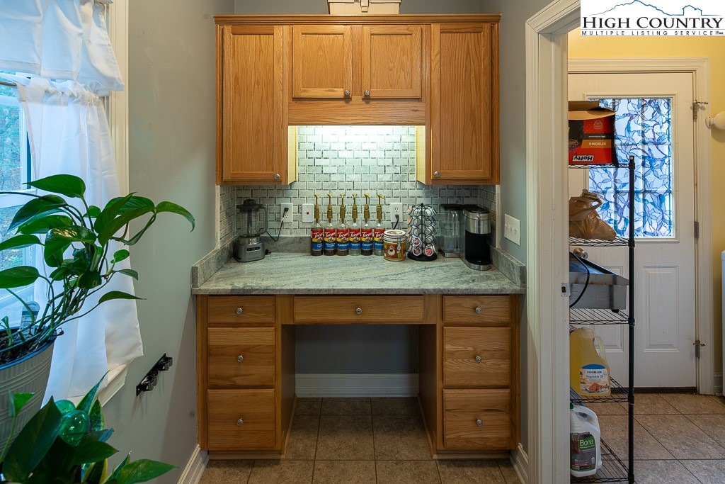 778 Roby Poe Road Crumpler, NC 28617 - Photo 18 of 50 a kitchen with a sink and cabinets