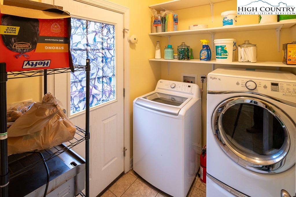 778 Roby Poe Road Crumpler, NC 28617 - Photo 19 of 50 a utility room with dryer and washer
