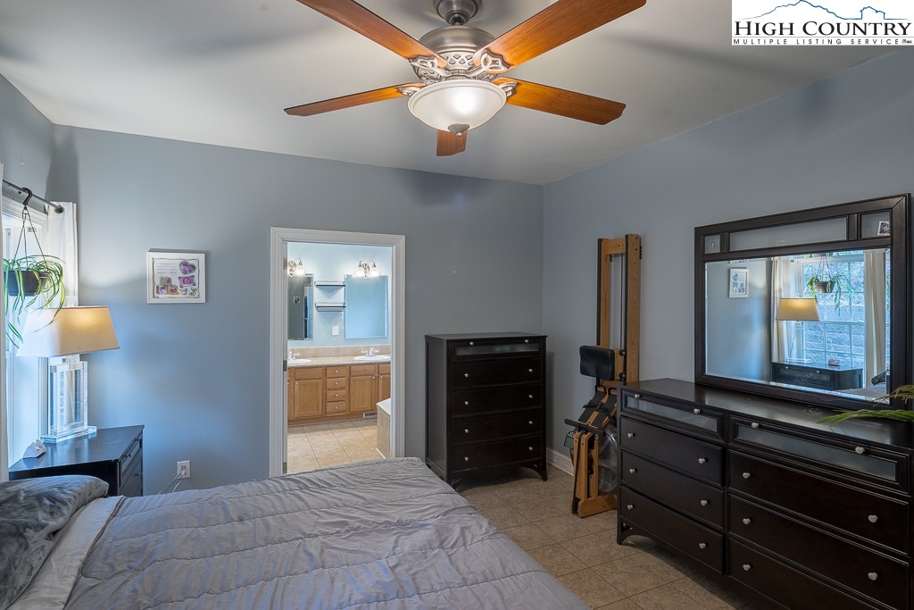 778 Roby Poe Road Crumpler, NC 28617 - Photo 21 of 50 a bedroom with a bed and a dresser
