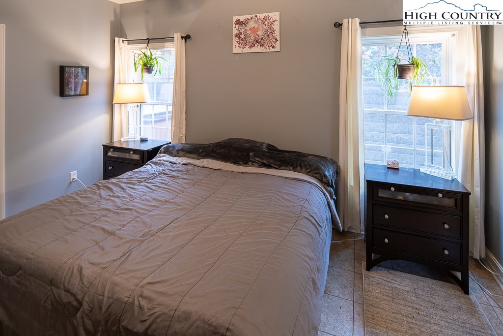 778 Roby Poe Road Crumpler, NC 28617 - Photo 22 of 50 a bedroom with a bed and a window