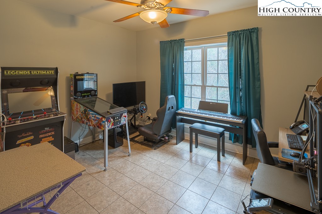 778 Roby Poe Road Crumpler, NC 28617 - Photo 26 of 50 a living room with furniture and a flat screen tv