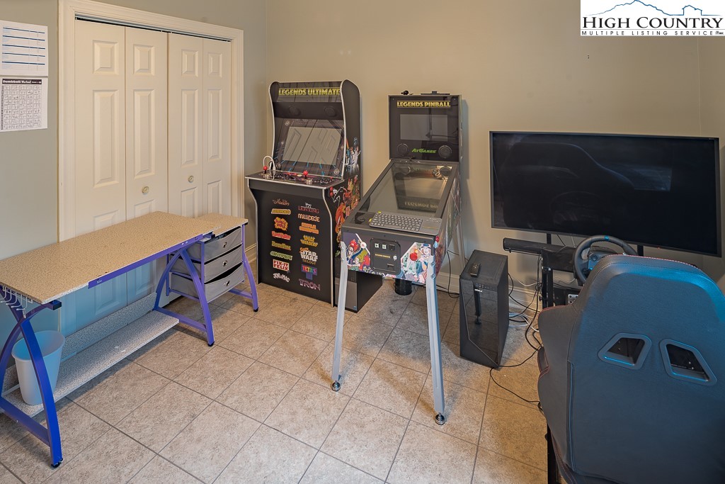 778 Roby Poe Road Crumpler, NC 28617 - Photo 27 of 50 a room with furniture a air conditioner vent and a window