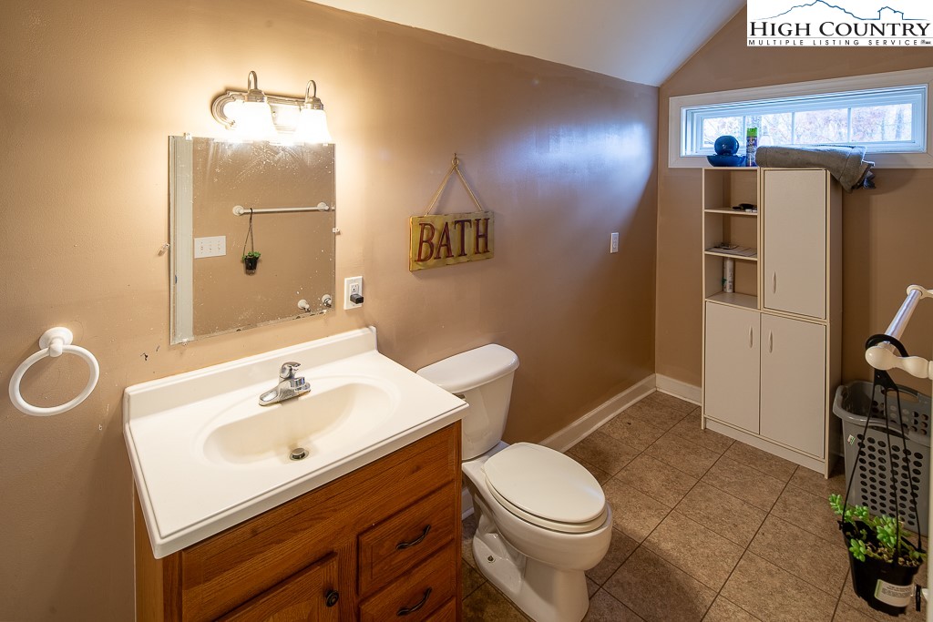 778 Roby Poe Road Crumpler, NC 28617 - Photo 32 of 50 a bathroom with a sink a toilet and shower