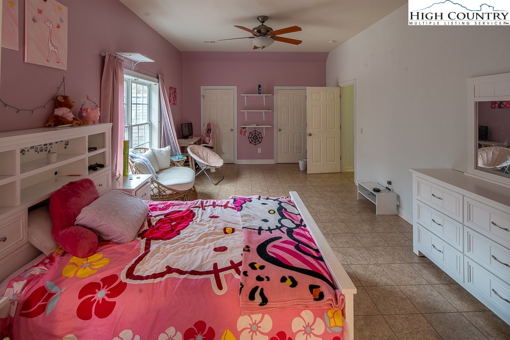 778 Roby Poe Road Crumpler, NC 28617 - Photo 35 of 50 a bedroom with a bed and a dresser in it