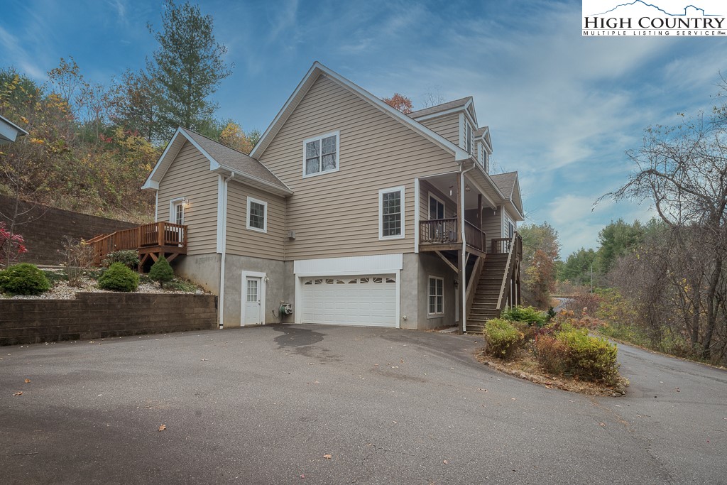 778 Roby Poe Road Crumpler, NC 28617 - Photo 42 of 50 a view of house with backyard and garden