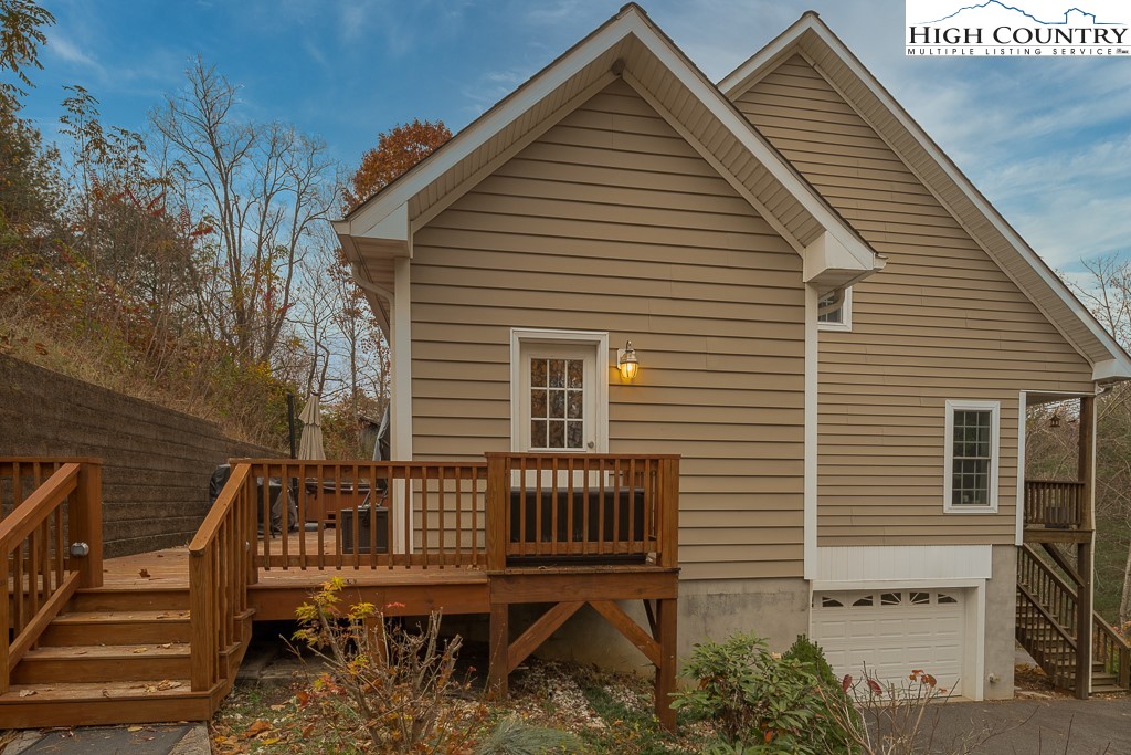778 Roby Poe Road Crumpler, NC 28617 - Photo 43 of 50 a view of a house with a deck and furniture