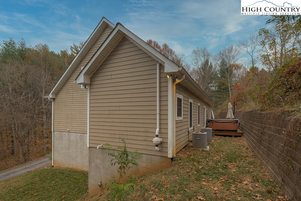 778 Roby Poe Road Crumpler, NC 28617 - Photo 45 of 50 a front view of a house with a yard