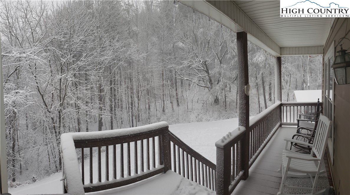 778 Roby Poe Road Crumpler, NC 28617 - Photo 47 of 50 a view of a balcony with wooden floor