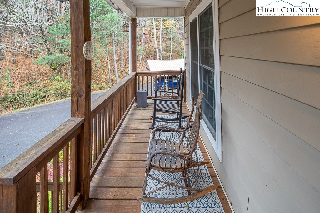 778 Roby Poe Road Crumpler, NC 28617 - Photo 6 of 50 a view of staircase with wooden floor and stairs