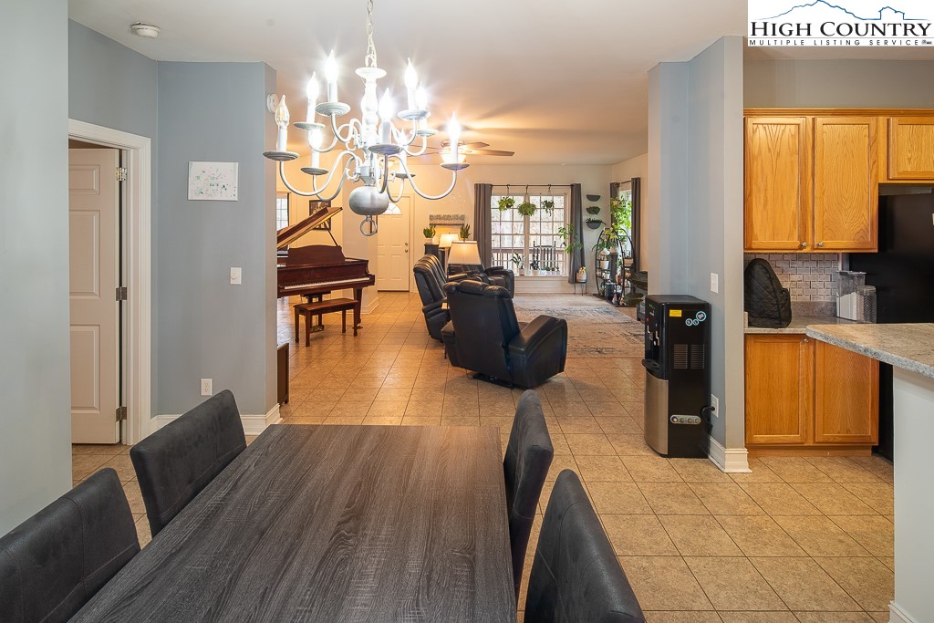 778 Roby Poe Road Crumpler, NC 28617 - Photo 10 of 50 a living room with furniture and a chandelier