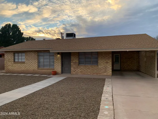front view of a house with a yard