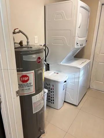 a utility room with washer and dryer