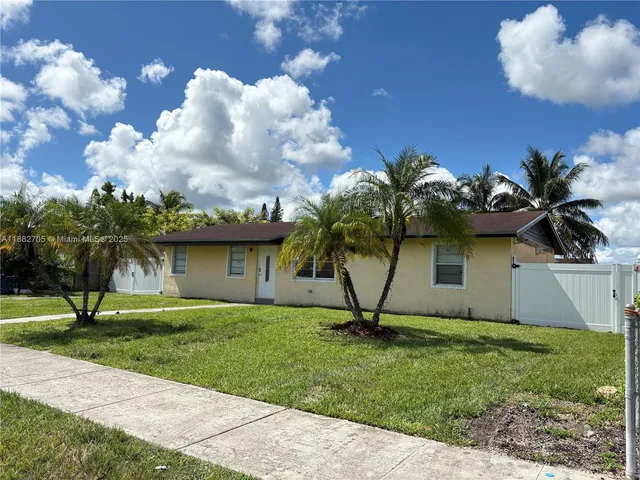 a view of a garden with a fountain