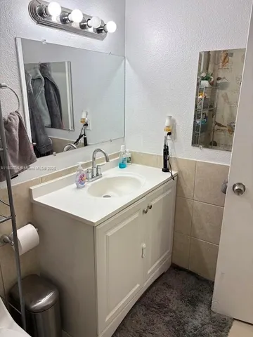 a bathroom with a bathtub and shower