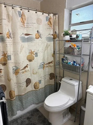 a bedroom with a bed and a mirror