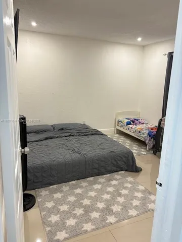 a view of walk in closet with clothes