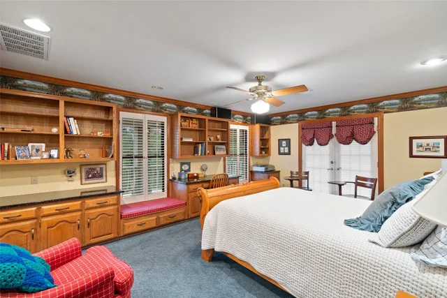 a bedroom with double bed and a large window