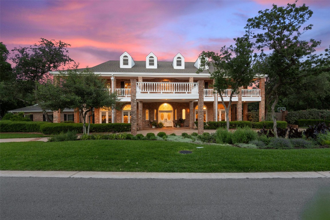 12 Hedge Lane Austin, TX 78746 - Photo 2 of 30 a front view of a house with a yard