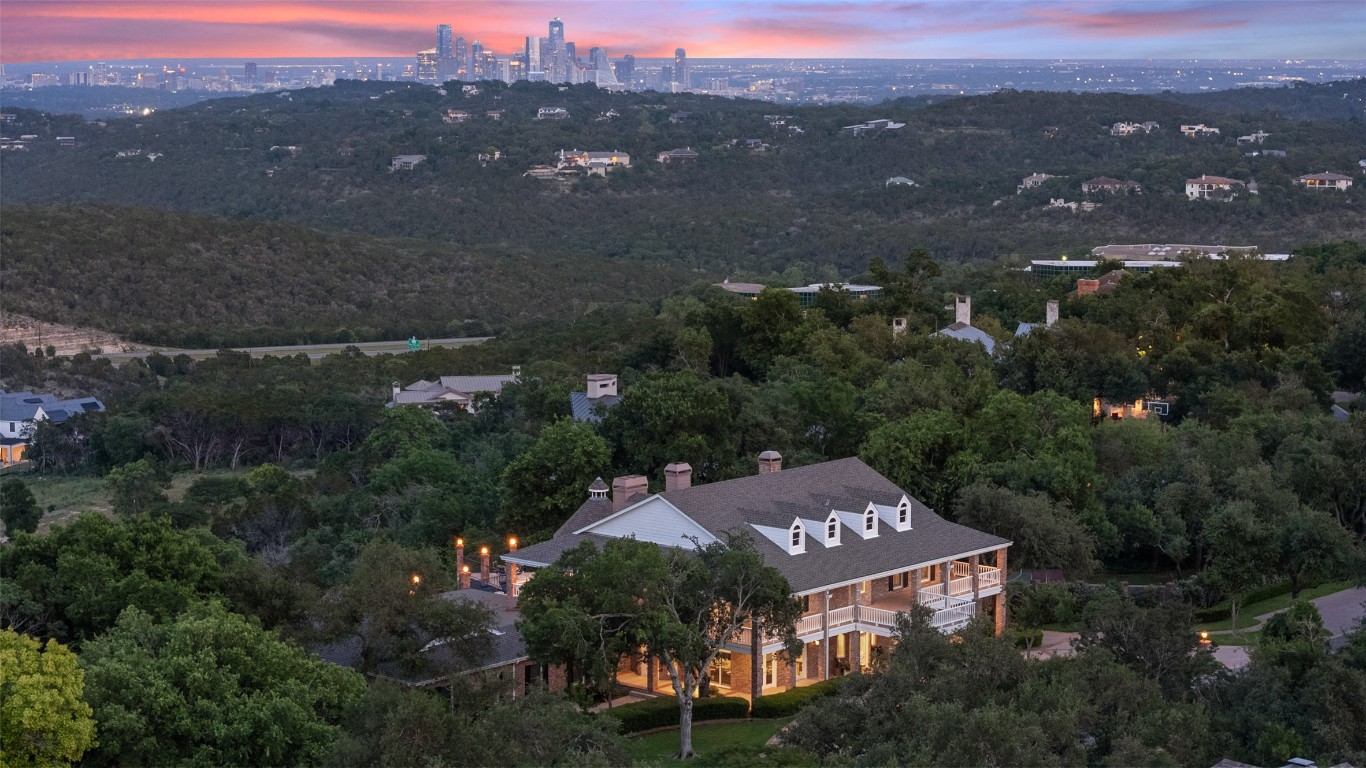12 Hedge Lane Austin, TX 78746 - Photo 4 of 30 an aerial view of a city with lots of residential buildings