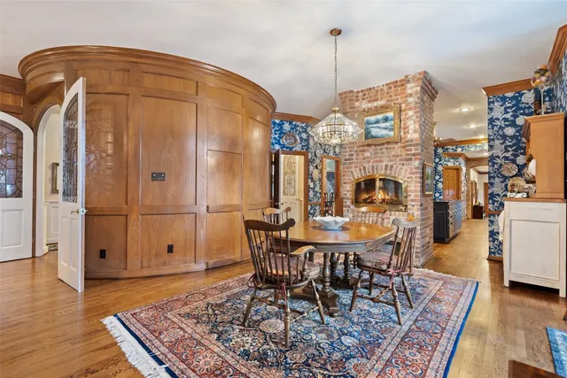 a dining room with furniture and wooden floor