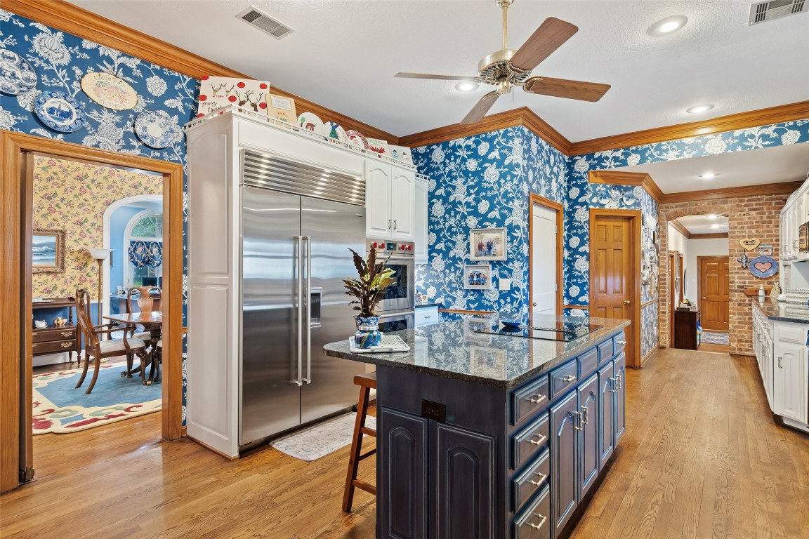 12 Hedge Lane Austin, TX 78746 - Photo 9 of 30 a kitchen with counter top space and wooden floor
