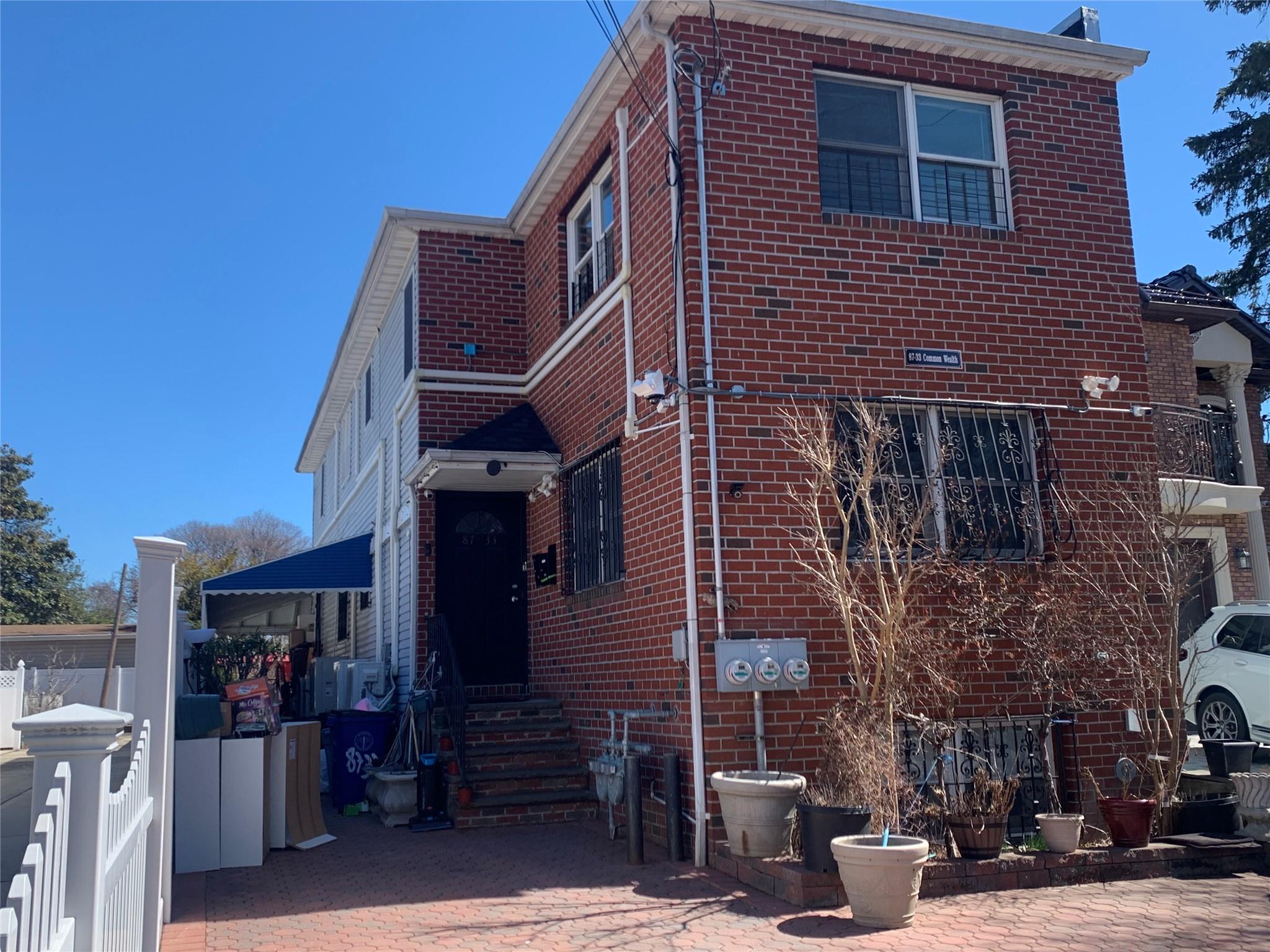 87-33 Commonwealth Boulevard Queens, NY 11426 - Photo 1 of 1 a view of a house with a garage