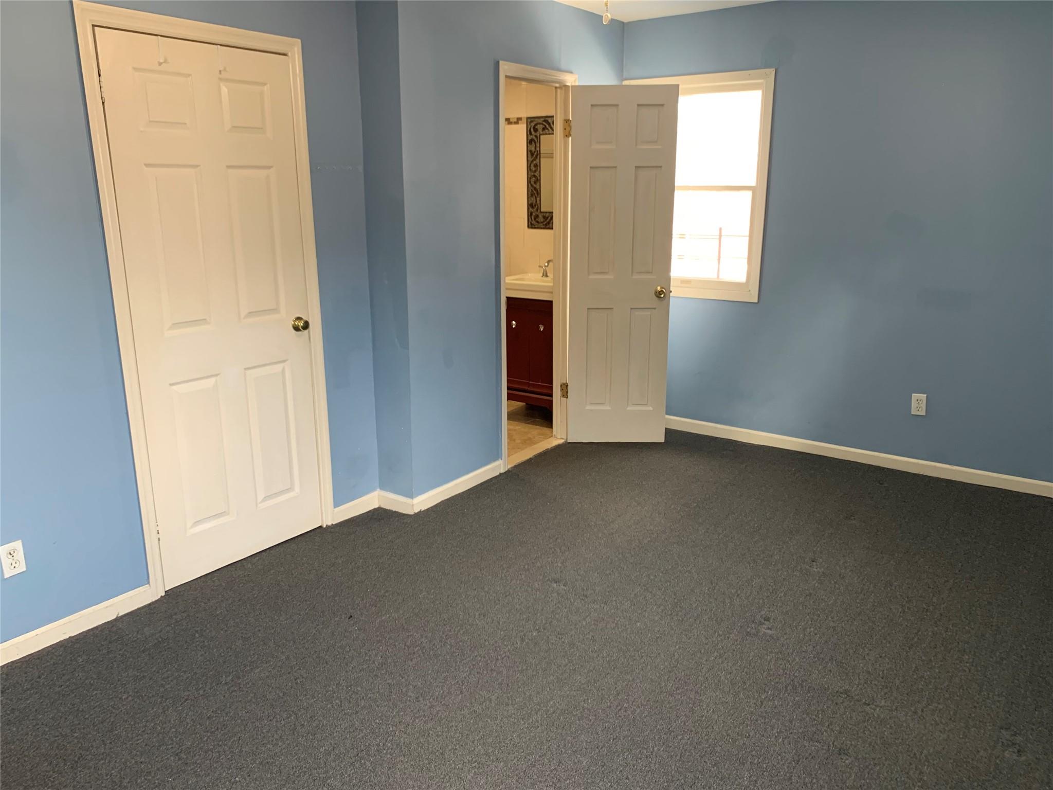 87-33 Commonwealth Boulevard Queens, NY 11426 - Photo 14 of 28 an empty room with windows