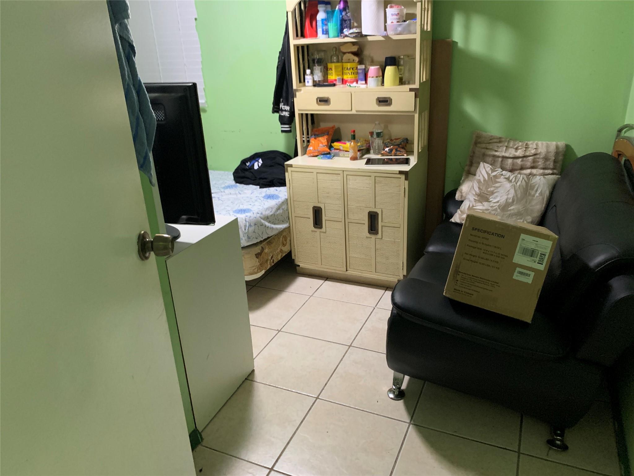 87-33 Commonwealth Boulevard Queens, NY 11426 - Photo 17 of 28 a room with furniture and a window