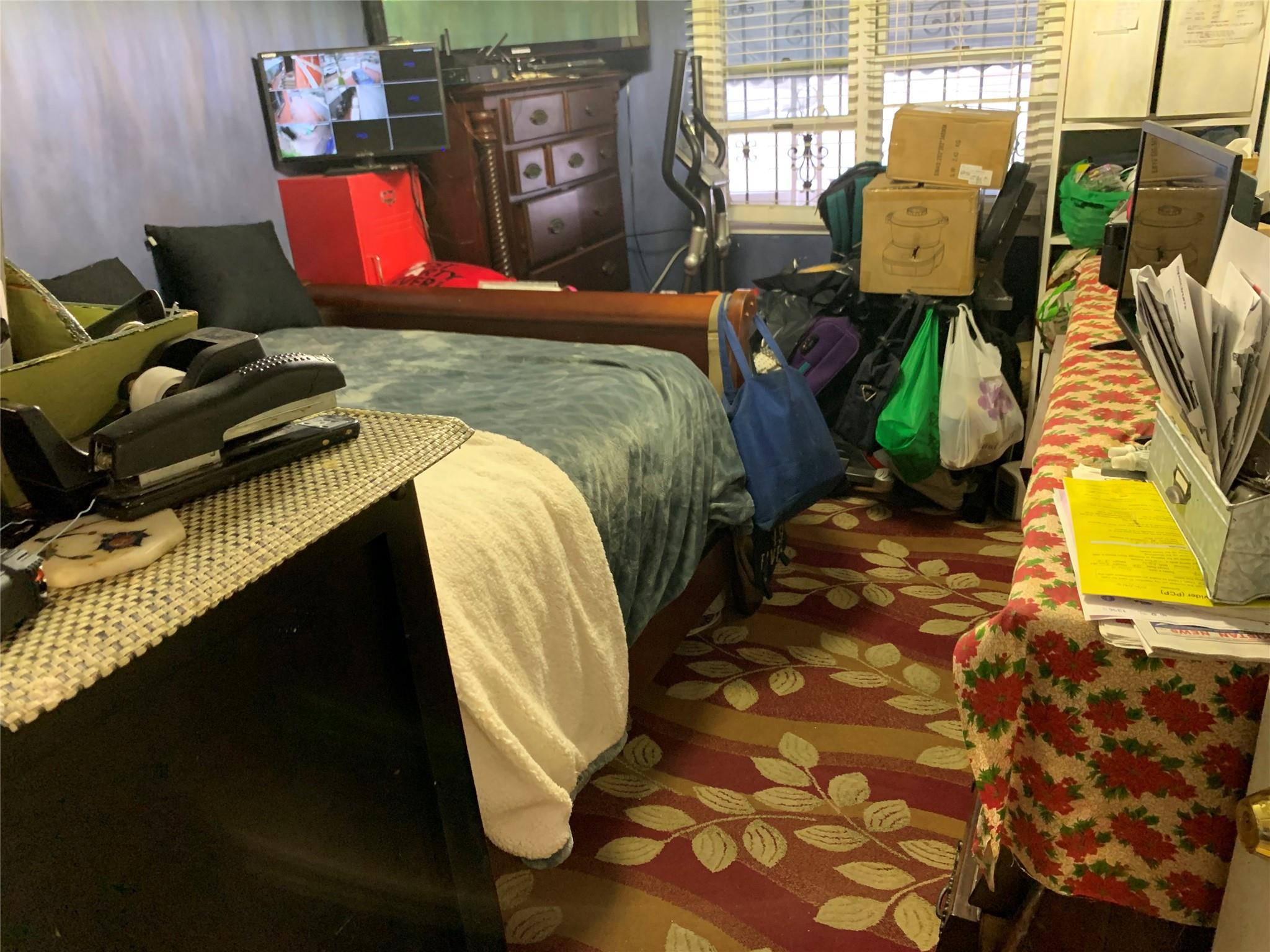 87-33 Commonwealth Boulevard Queens, NY 11426 - Photo 20 of 28 a bedroom with bed and a mirror