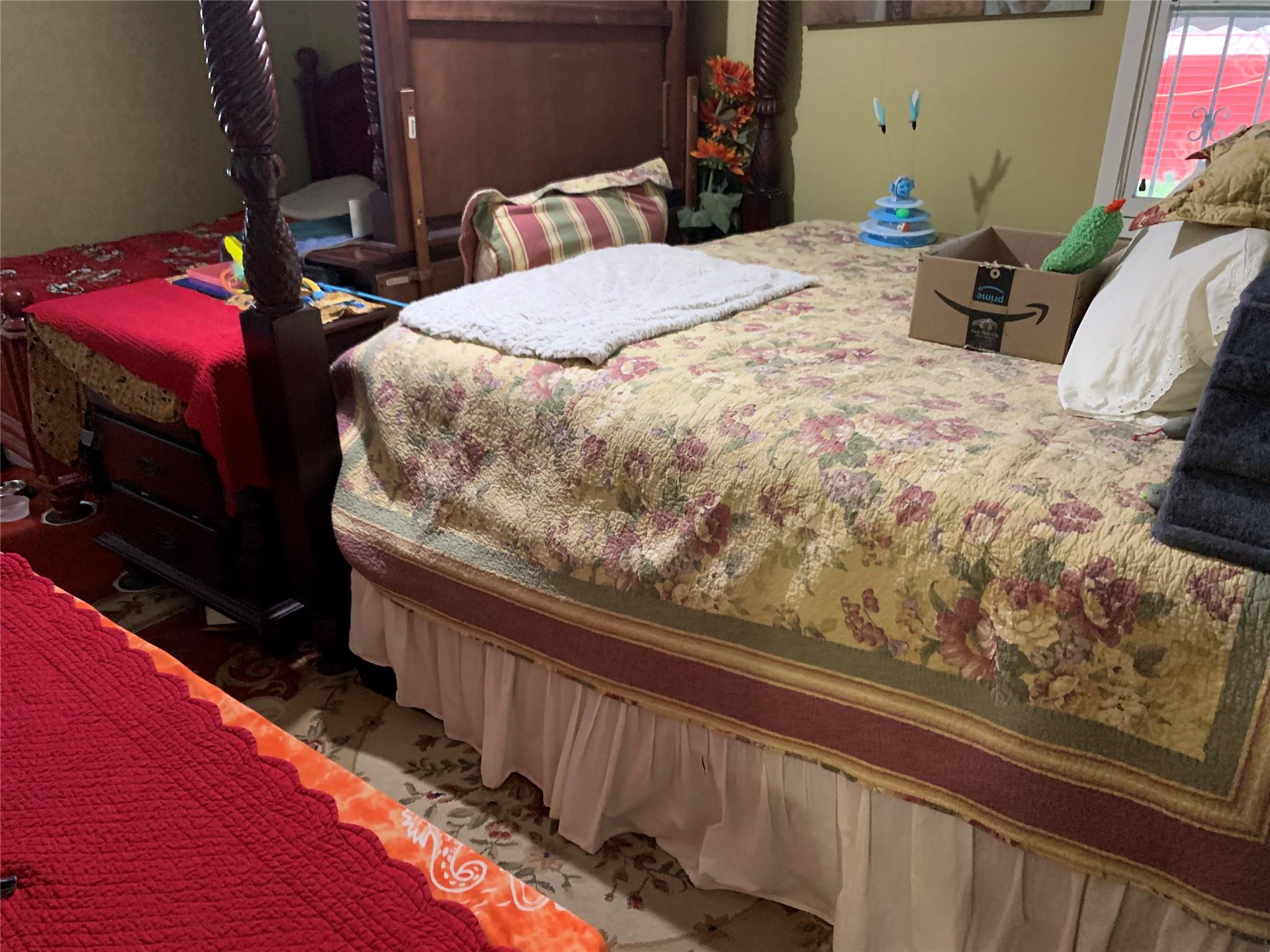 87-33 Commonwealth Boulevard Queens, NY 11426 - Photo 21 of 28 a bedroom with a bed and a view of balcony