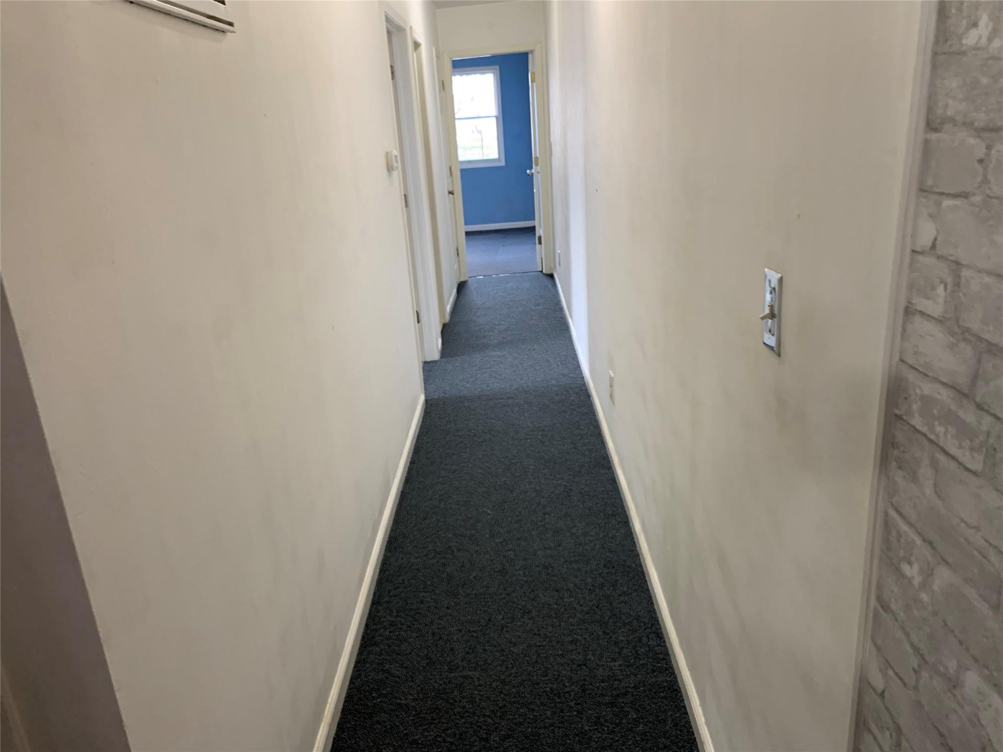 87-33 Commonwealth Boulevard Queens, NY 11426 - Photo 9 of 28 a view of a hallway with wooden floor