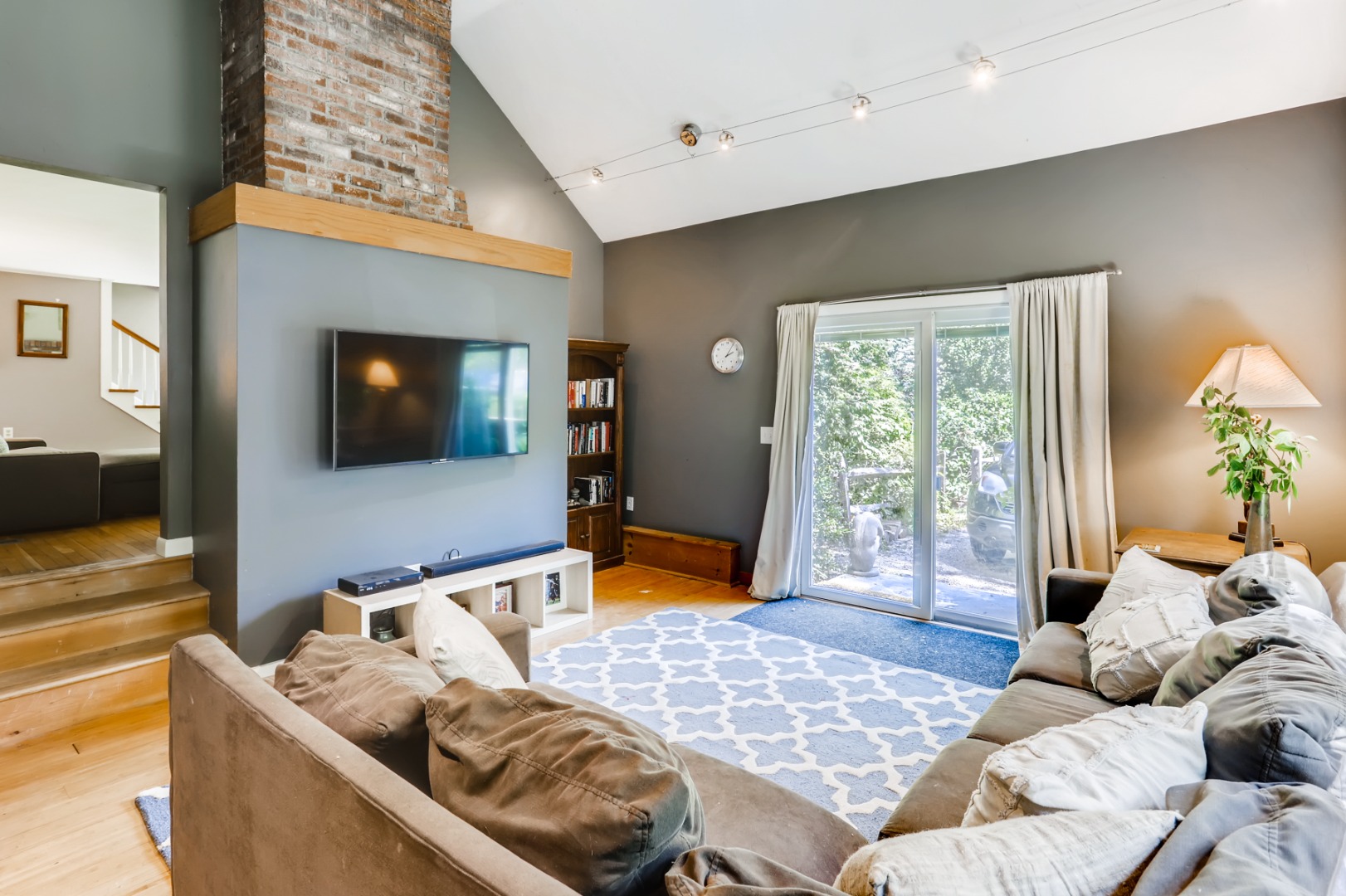 377 State Road West Tisbury, MA 02568 - Photo 12 of 36 a bedroom with furniture and a flat screen tv