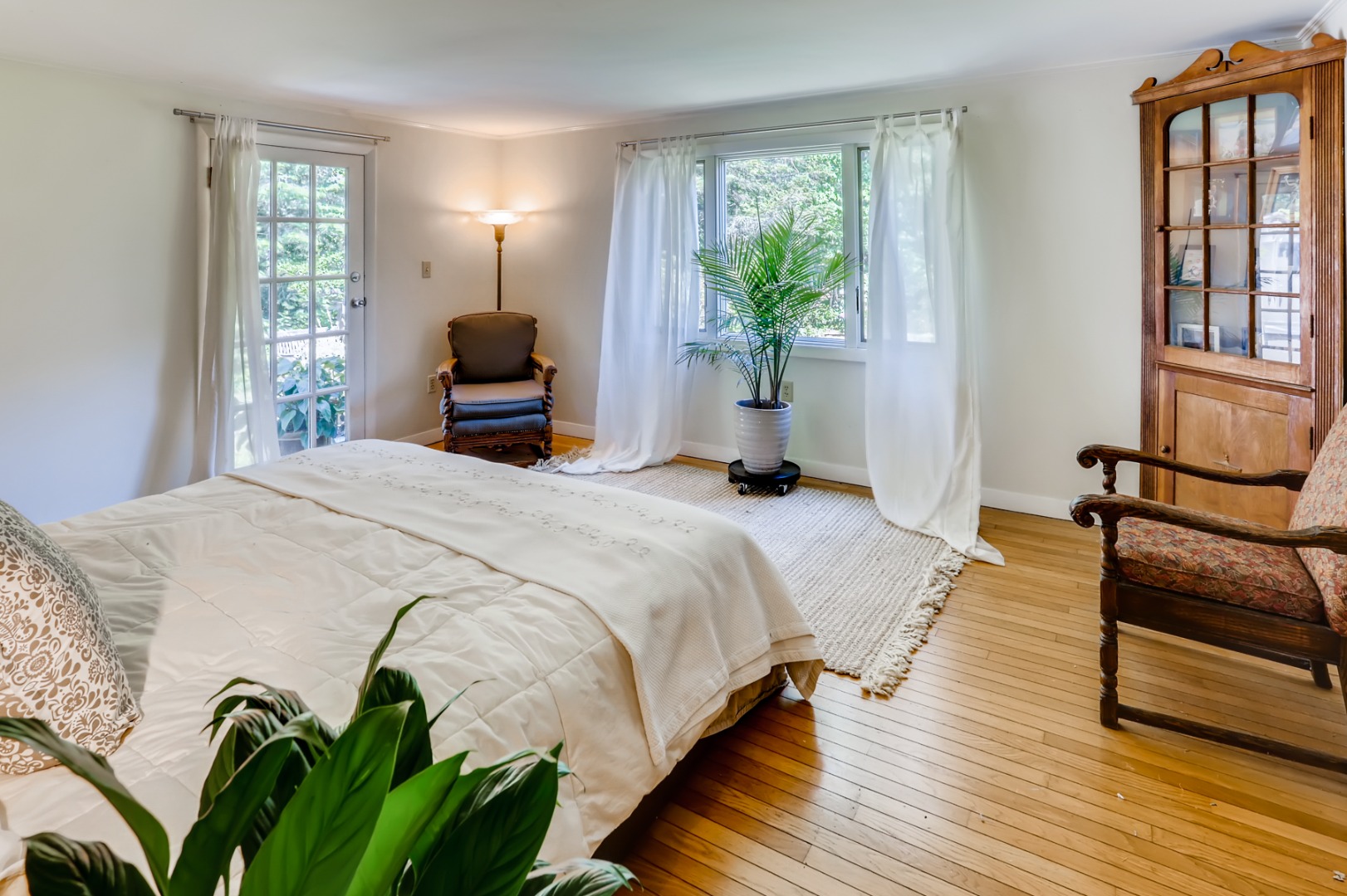 377 State Road West Tisbury, MA 02568 - Photo 16 of 36 a bedroom with a bed lamps and window