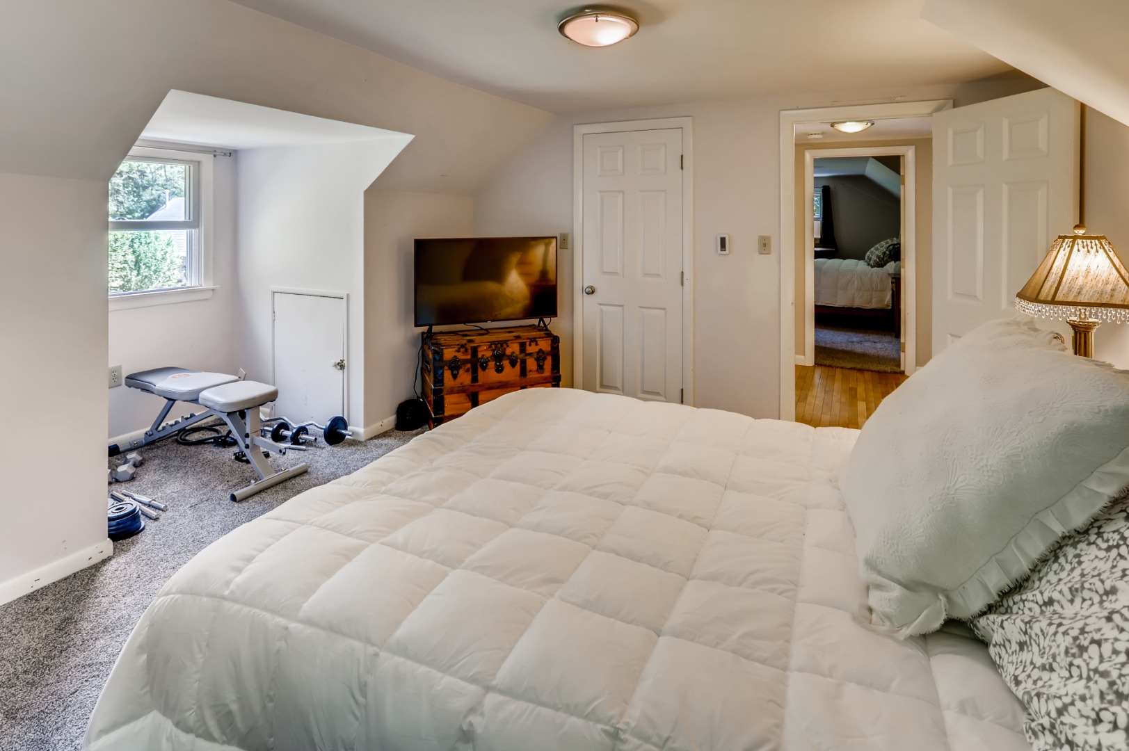 377 State Road West Tisbury, MA 02568 - Photo 22 of 36 a bedroom with a bed and a flat screen tv