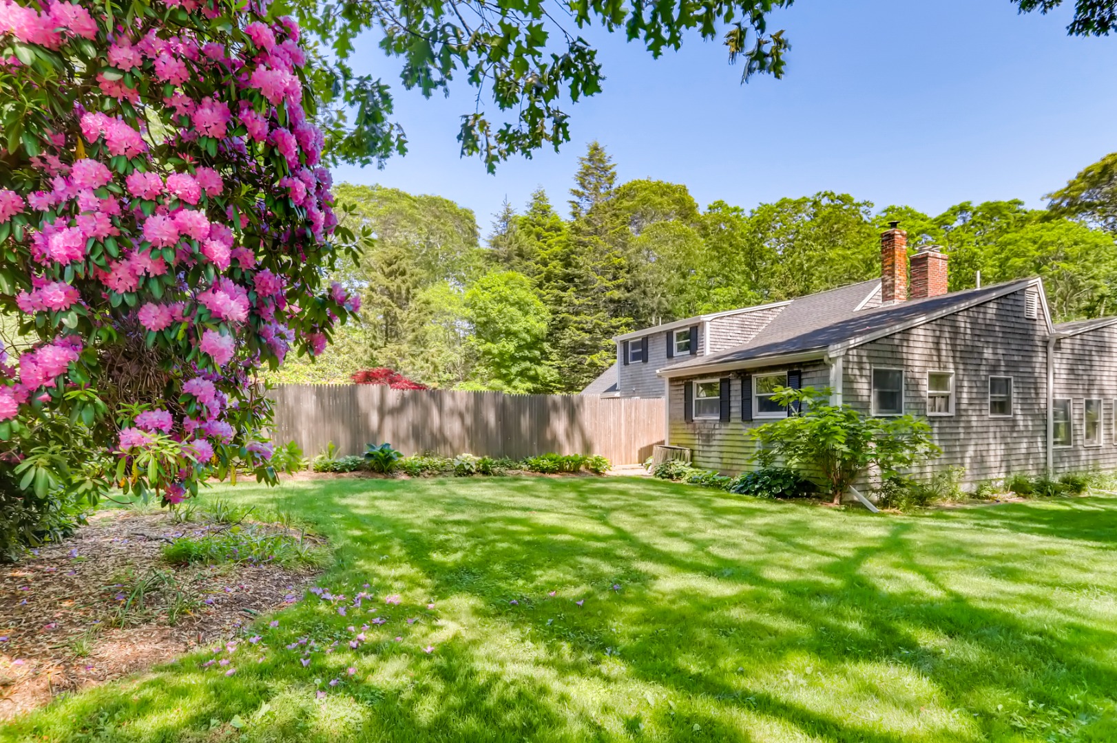 377 State Road West Tisbury, MA 02568 - Photo 23 of 36 a view of a house with a big yard and potted plants