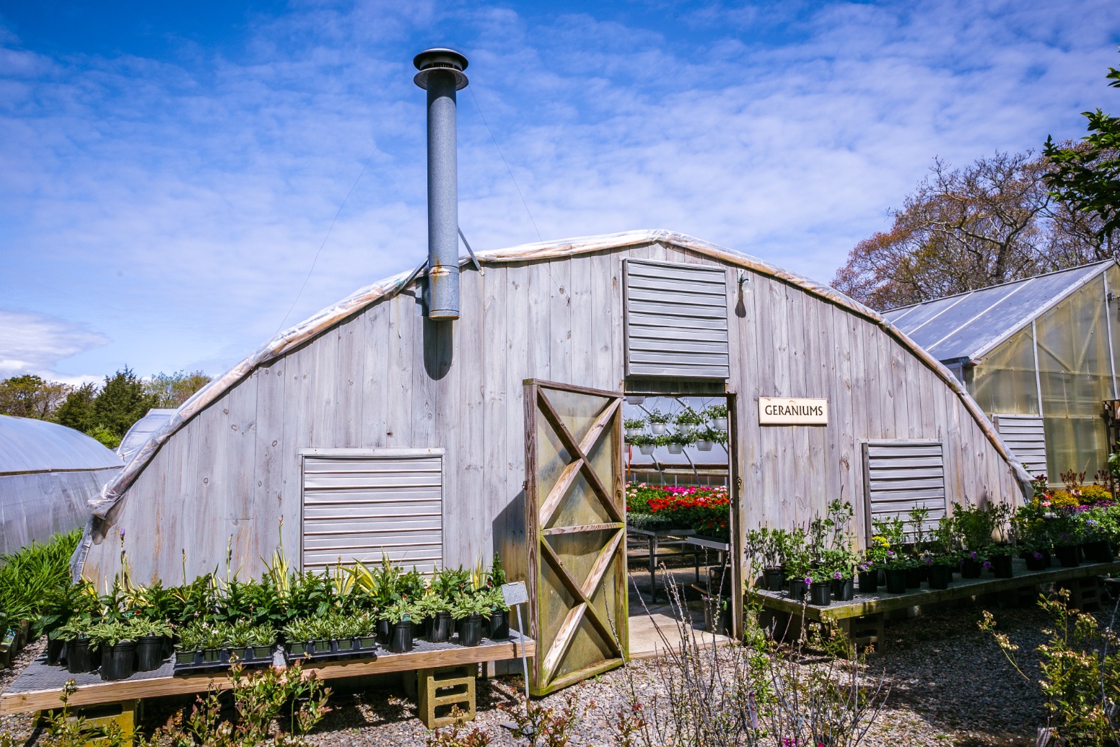 377 State Road West Tisbury, MA 02568 - Photo 33 of 36 a front view of a house with plants