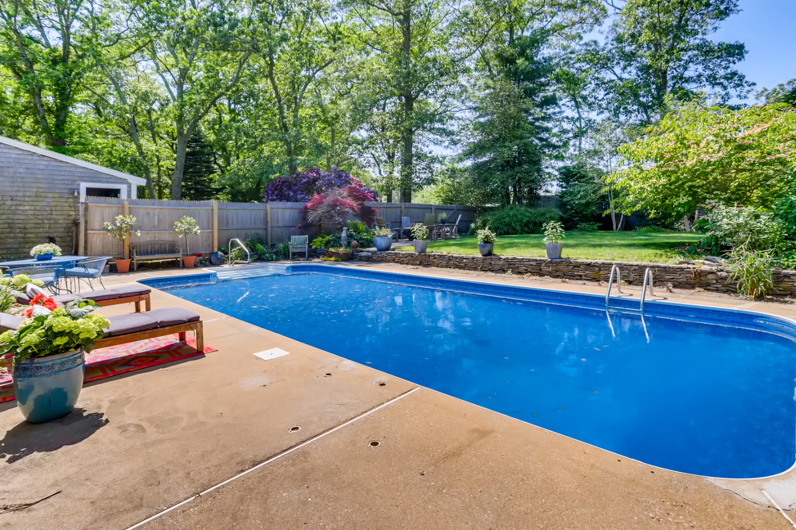 377 State Road West Tisbury, MA 02568 - Photo 7 of 36 a backyard of a house with table and chairs