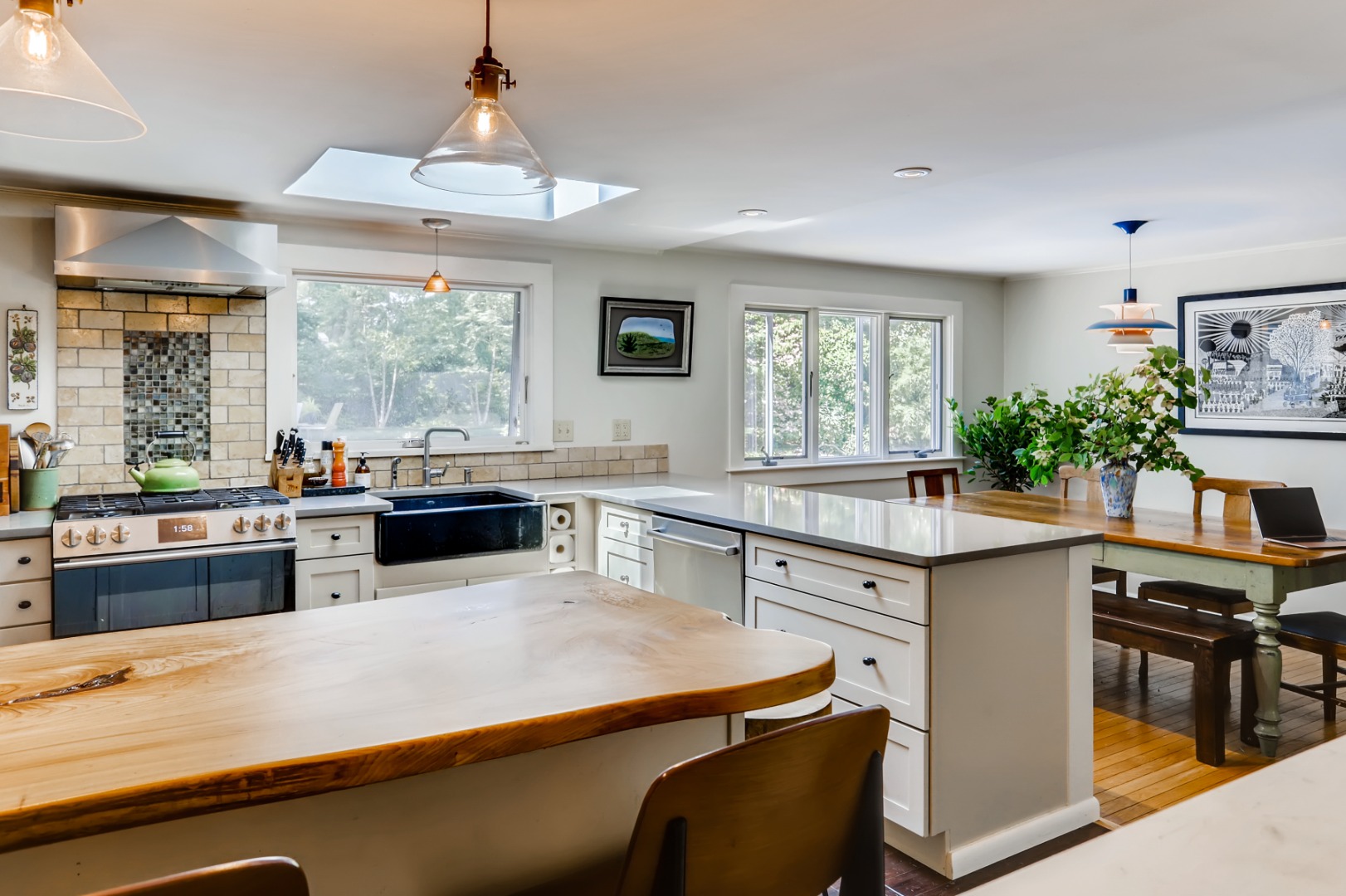 377 State Road West Tisbury, MA 02568 - Photo 8 of 36 a kitchen with stainless steel appliances granite countertop a stove and a refrigerator