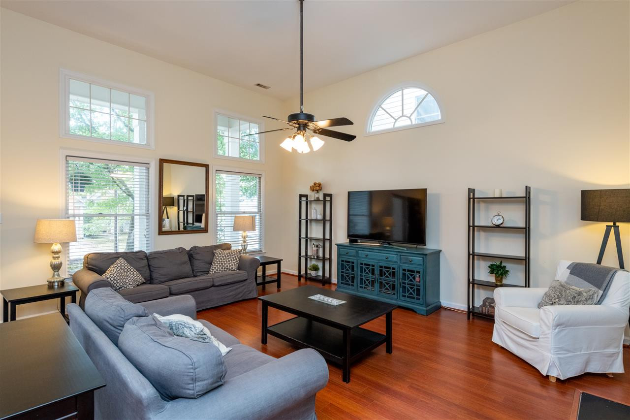 12116 Mabledon Court Raleigh, NC 27613 - Photo 6 of 30 Open Family Room with Tall Ceilings, Engineered Hardwoods and Fireplace Family Room