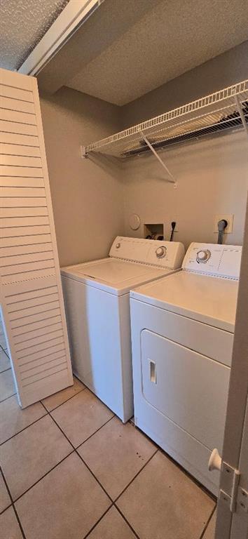 301 Palm Way, Unit 107 Pembroke Pines, FL 33025 - Photo 17 of 36 a utility room with dryer and washer