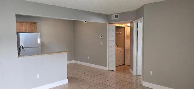 a view of a bathroom with a shower and a sink