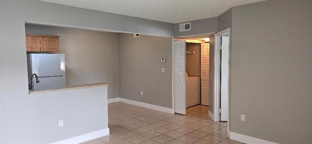 301 Palm Way, Unit 107 Pembroke Pines, FL 33025 - Photo 2 of 36 a view of a bathroom with a shower and a sink