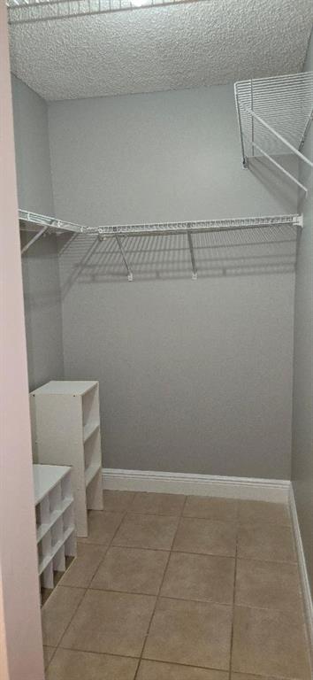 301 Palm Way, Unit 107 Pembroke Pines, FL 33025 - Photo 24 of 36 a view of a room with racks on the wall