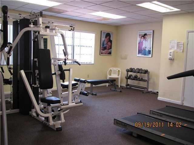 301 Palm Way, Unit 107 Pembroke Pines, FL 33025 - Photo 29 of 36 a view of a room with gym equipment