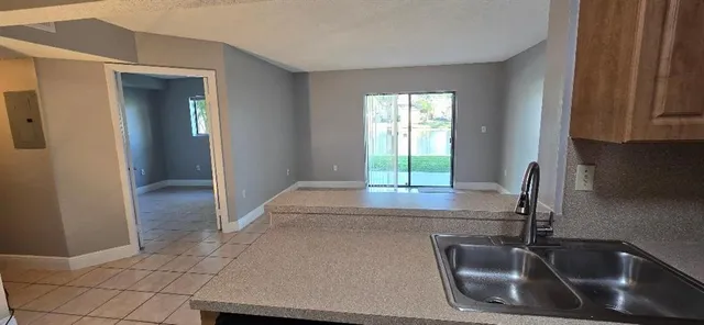 a kitchen with a sink and a window