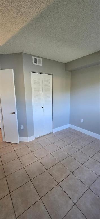 301 Palm Way, Unit 107 Pembroke Pines, FL 33025 - Photo 6 of 36 a view of an empty room and wooden floor