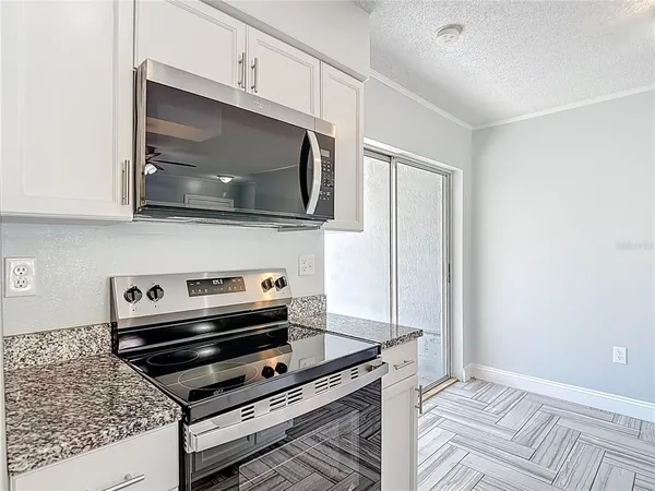 a view of an empty room with glass door