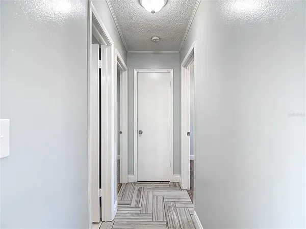 a bathroom with a granite countertop sink and a toilet