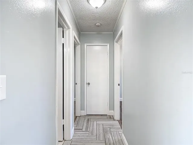 a bathroom with a granite countertop sink and a toilet