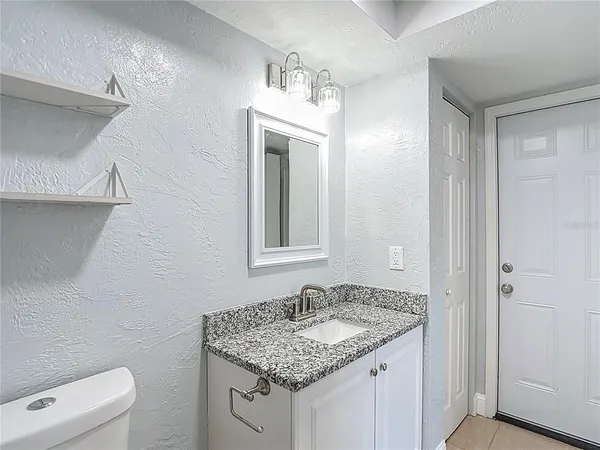 a bathroom with a shower and a toilet